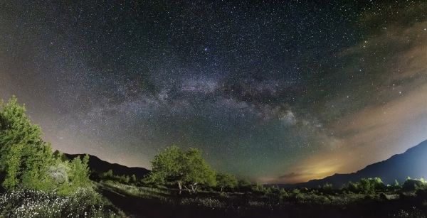 The arc of the Milky Way over the hamlet of Paporotny - Astrophotography