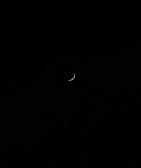 A small crescent moon captured with a camera. - Astrophotography