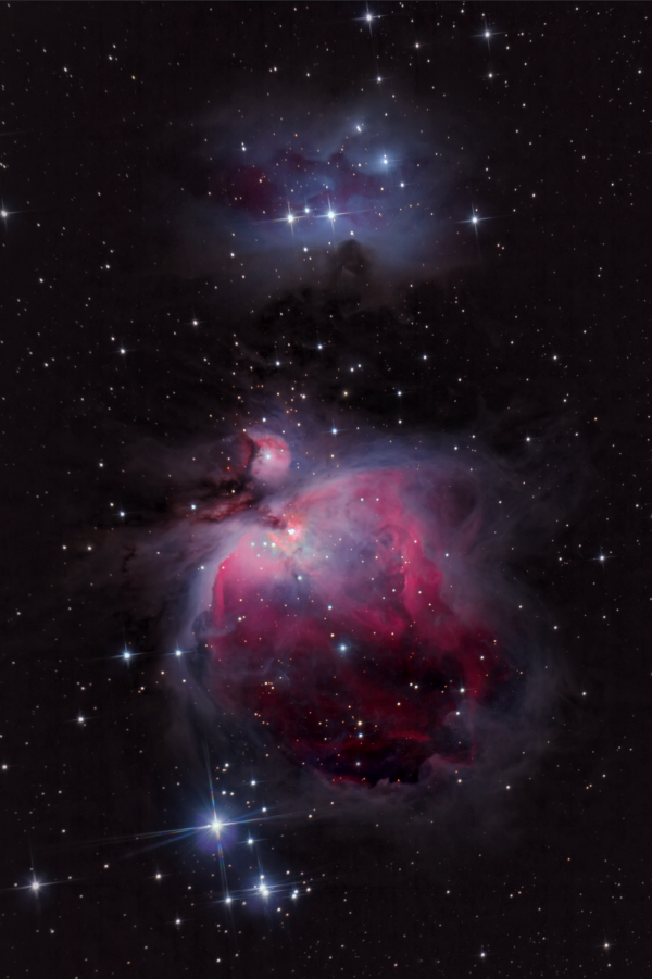 The diffuse nebula M42, also known as the Great Orion Nebula, and NGC 1977, the 