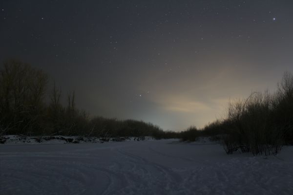 Stars over the snow-covered river - Astrophotography